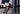 man in blue suit wearing orange patterned organic cotton dress socks